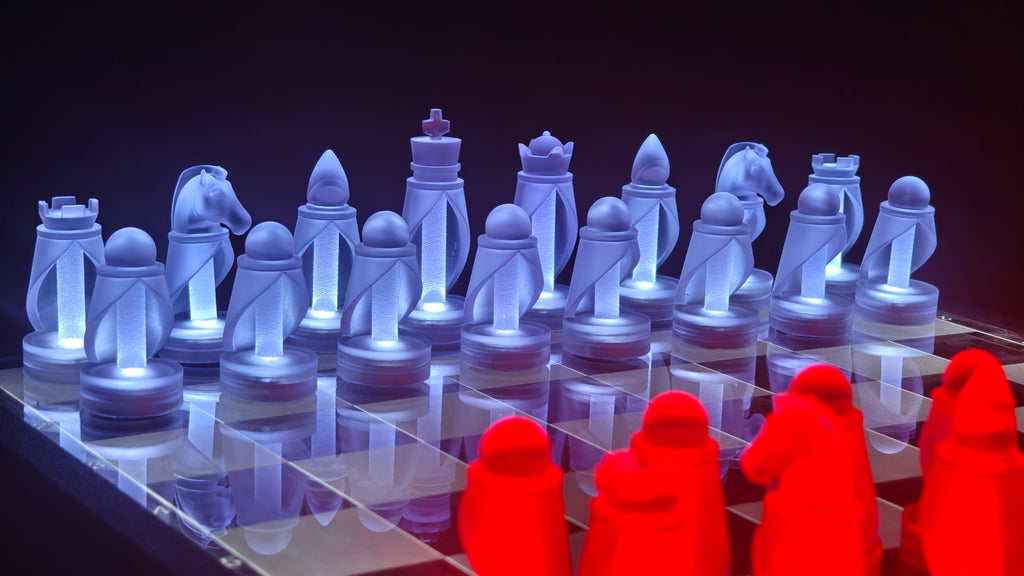 Chess set with blue and red pieces on a dark background