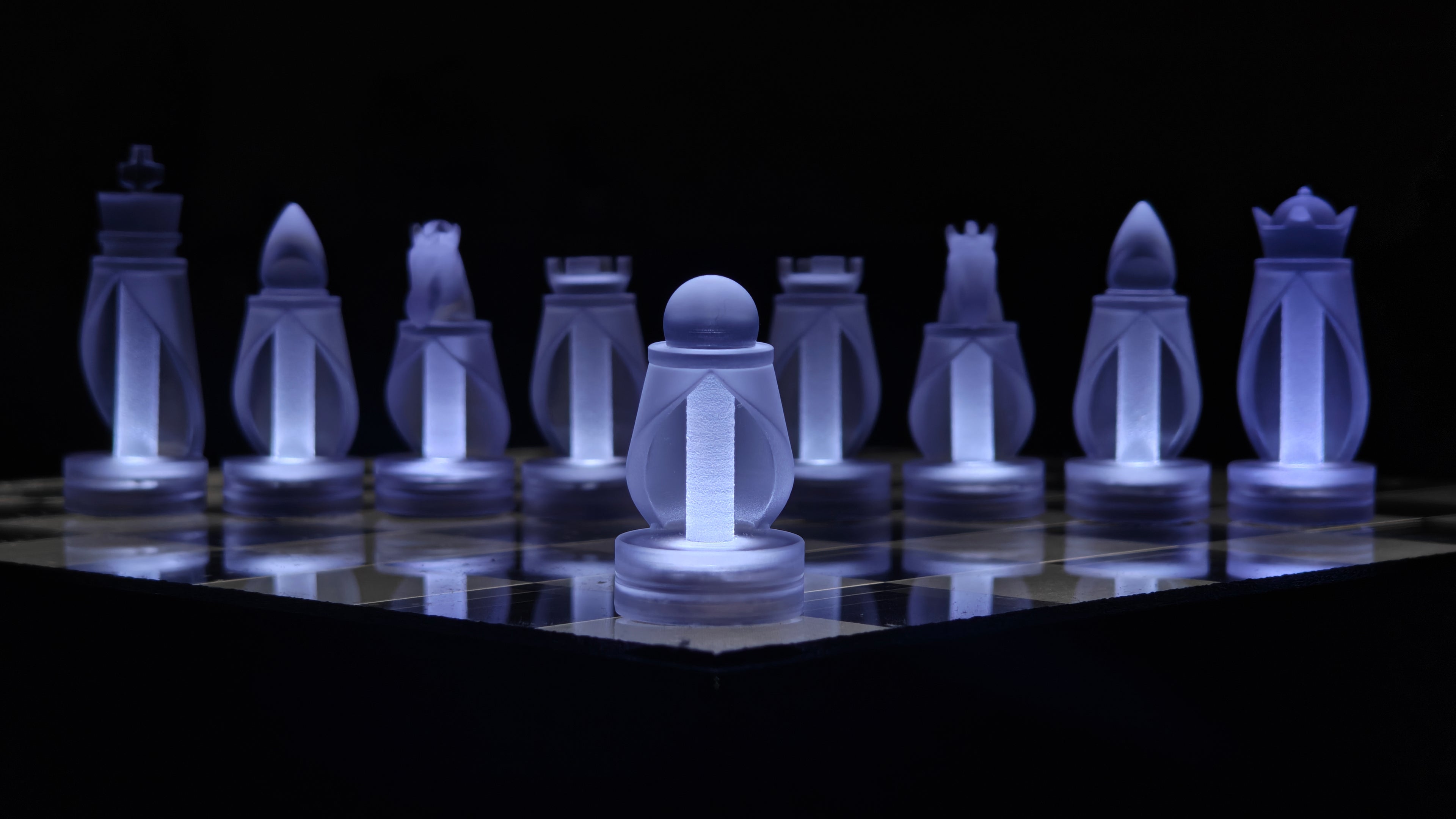 Glowing translucent chess pieces on a chessboard against a black background